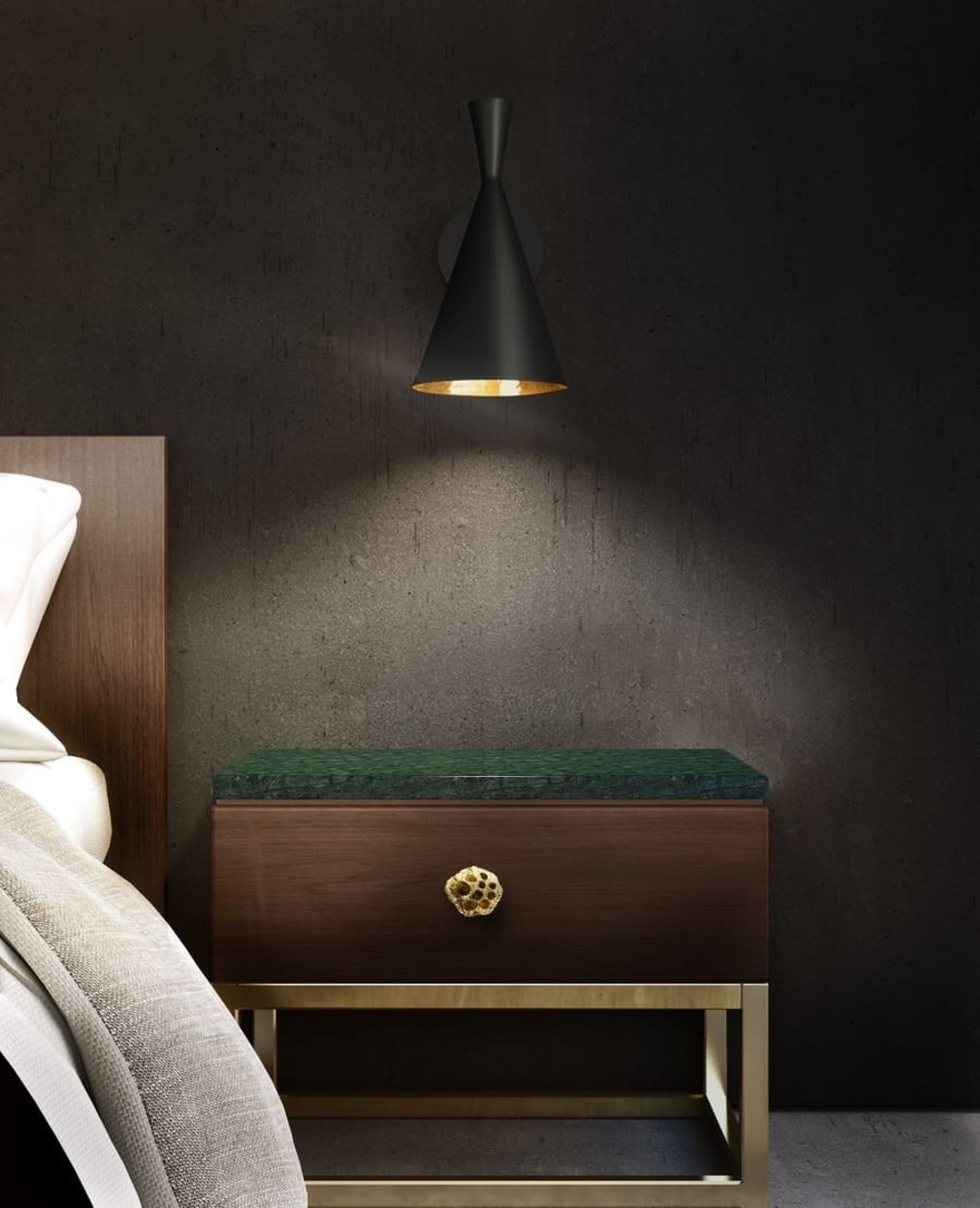 A black bedroom is no easy feat, but this space nails it. The black wall is extra luxurious contrasting against the wall lamp from Delightfull and emerald green accent in the bedside table from Brabbu.