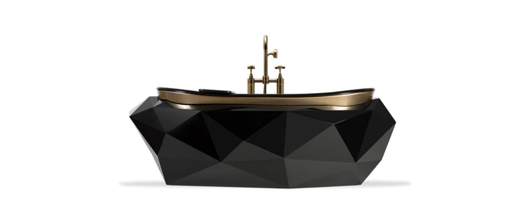 A black marble tub that combines with golden and black bathroom furniture, a perfect example of a modern classic luxury bathroom.