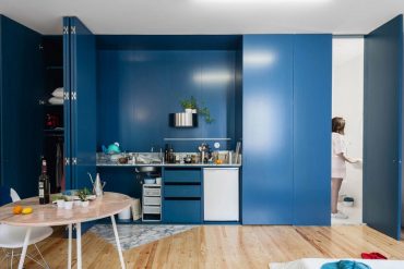 Fala Atelier designs Apartment in Porto Features Deep Blue Shutters