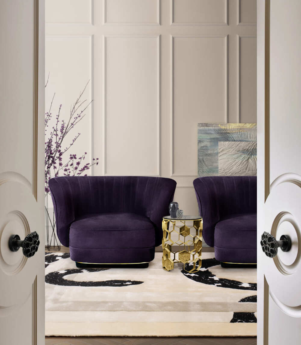 The Elk Armchair in a purple tone gives a touch of color to the space that combines really well with the Manuka Side Table and the Imperial Snake Rug.