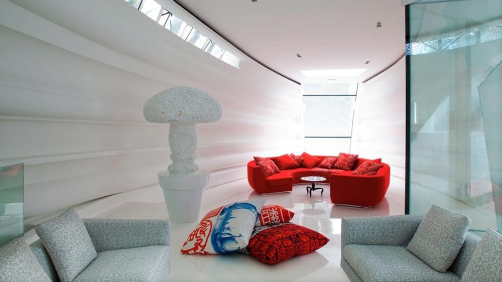 Marcel Wanders design this exquisite open space, where the centerpiece is a bold red sofa.